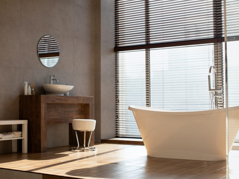 modern-bathroom-with-panoramic-window-in-luxury-apartment.jpg
